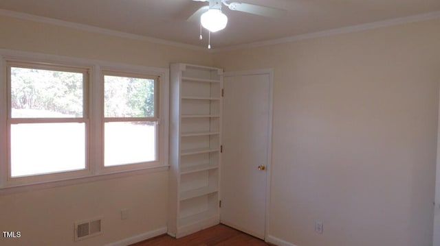 interior space featuring hardwood / wood-style floors, ceiling fan, and crown molding