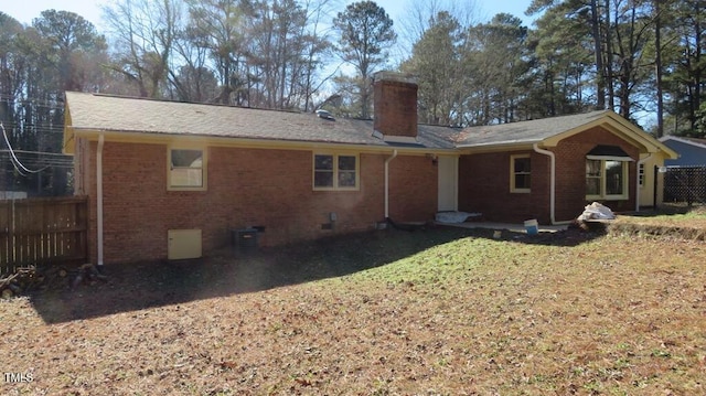 rear view of property featuring cooling unit