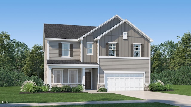 view of front of house with a front yard and a garage