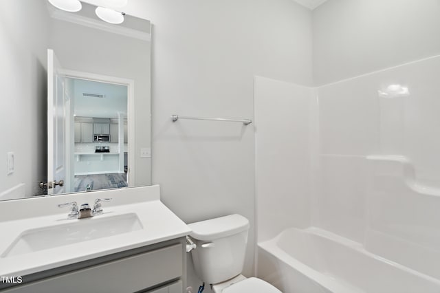 full bathroom with tub / shower combination, vanity, and toilet