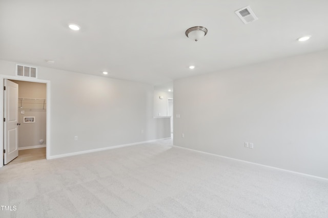 empty room with light colored carpet