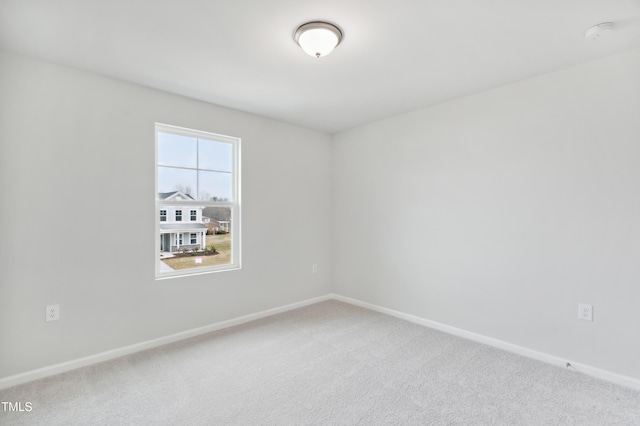 unfurnished room featuring carpet