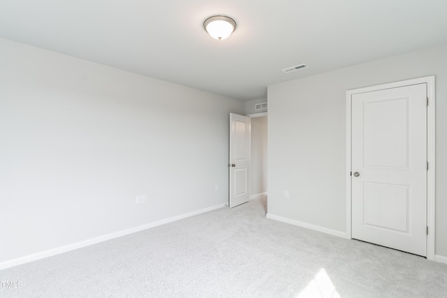 unfurnished bedroom featuring light carpet