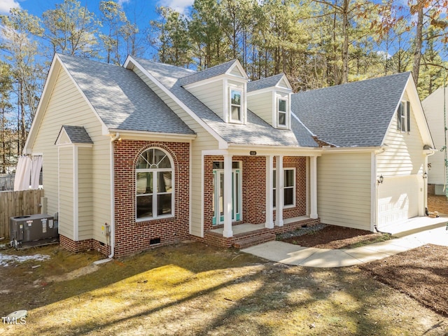 cape cod-style house with a front lawn