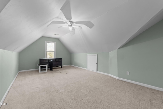 bonus room featuring ceiling fan, light carpet, and lofted ceiling