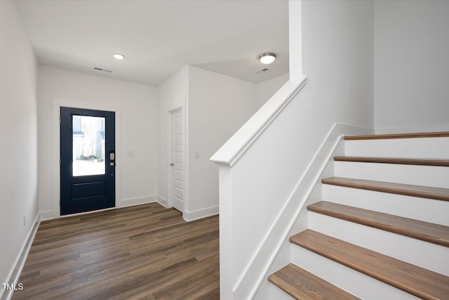 entrance foyer featuring dark hardwood / wood-style floors