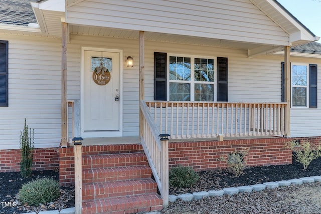 property entrance featuring a porch