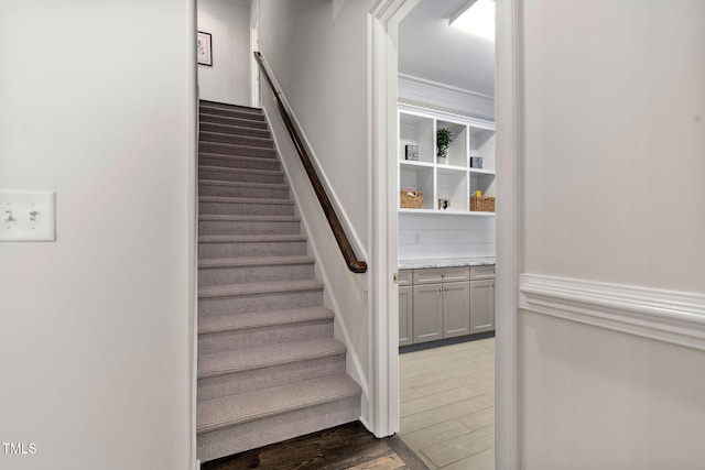 staircase featuring hardwood / wood-style flooring