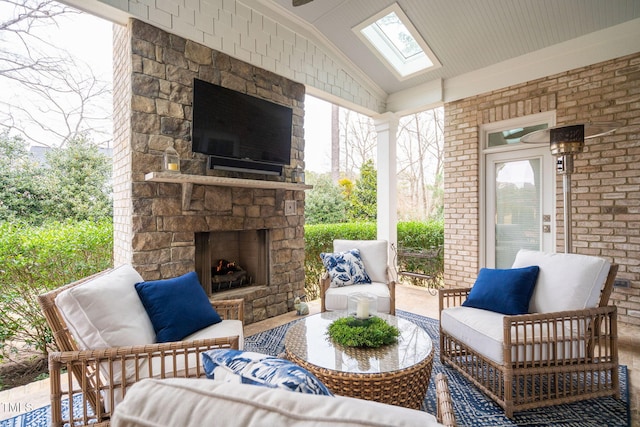 view of patio / terrace with an outdoor stone fireplace