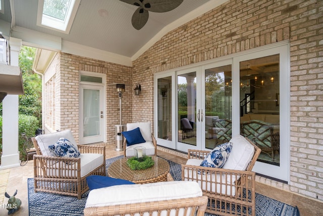 view of patio featuring ceiling fan, an outdoor hangout area, and french doors