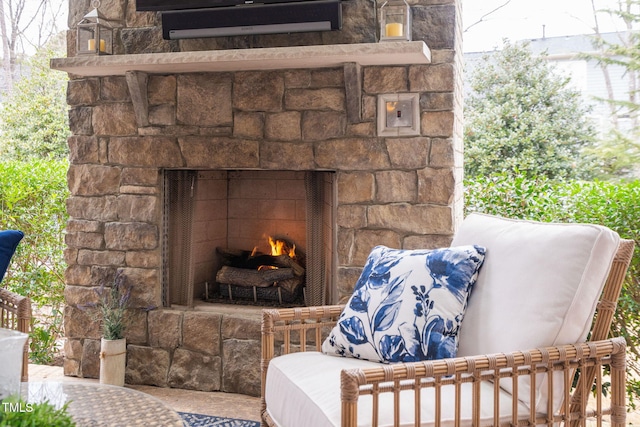 details featuring an outdoor stone fireplace