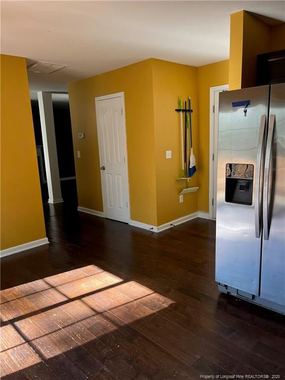 kitchen featuring dark hardwood / wood-style floors and stainless steel refrigerator with ice dispenser