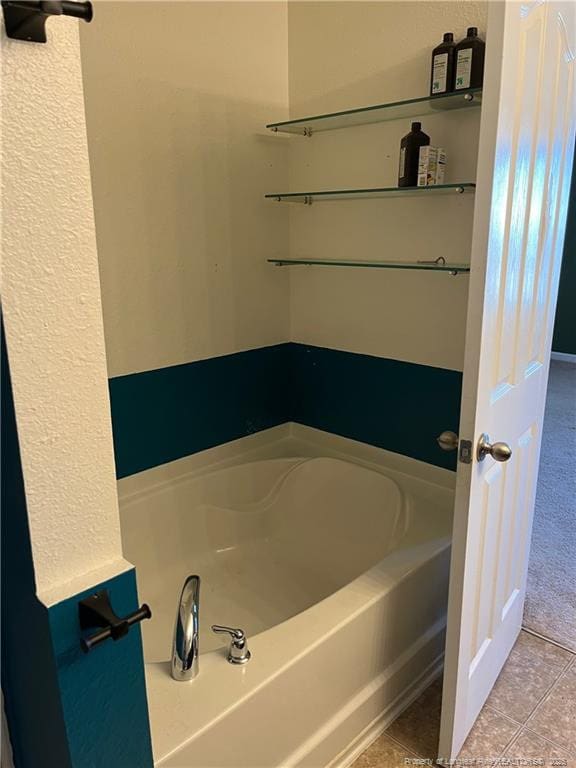 bathroom featuring a bathtub and tile patterned flooring