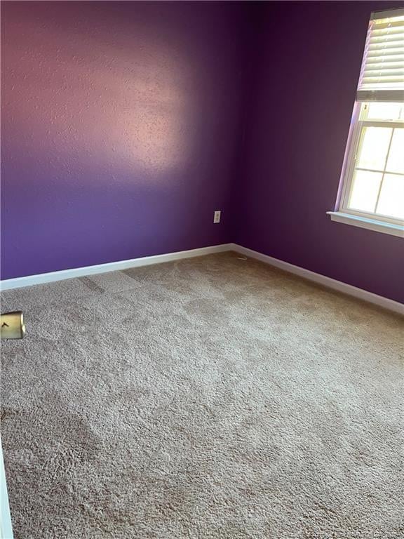 empty room with carpet flooring