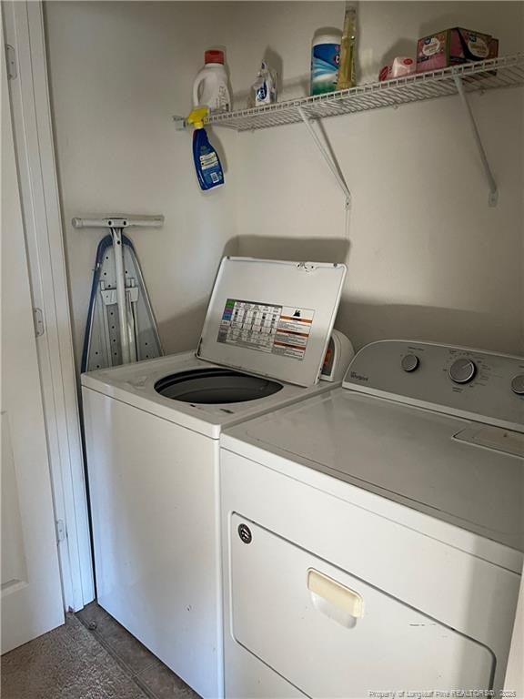 clothes washing area featuring washing machine and clothes dryer