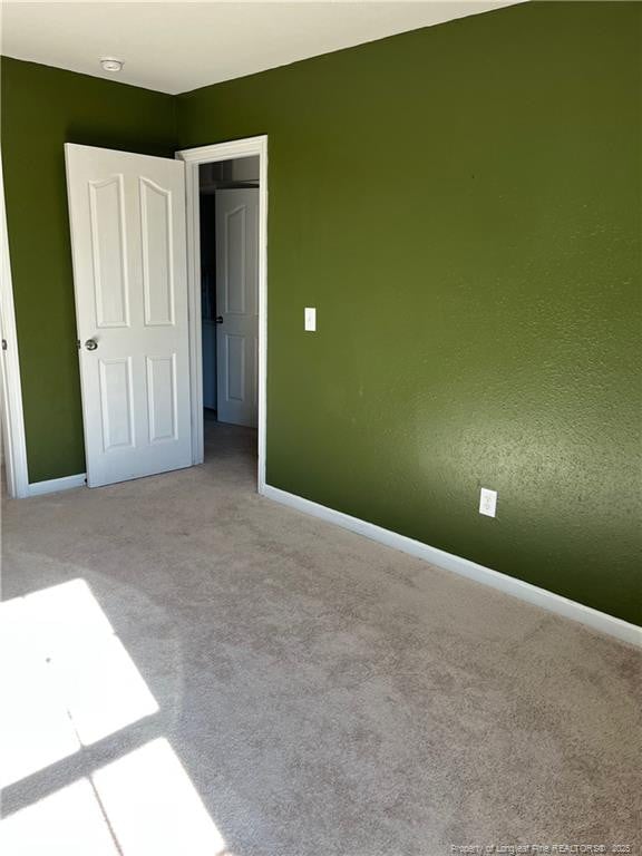 unfurnished bedroom with carpet floors