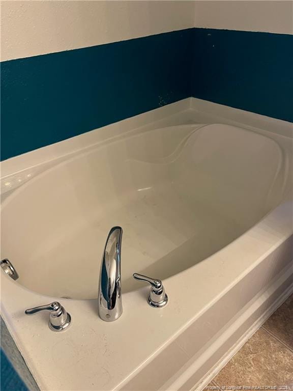room details featuring a tub to relax in
