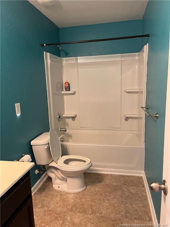 full bath featuring shower / washtub combination, toilet, baseboards, and vanity