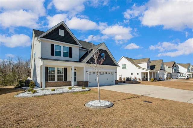 craftsman-style house featuring a front yard, a garage, and cooling unit