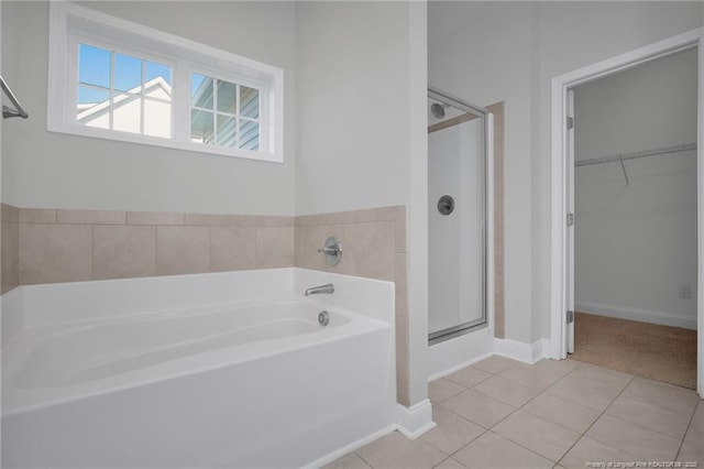 bathroom featuring separate shower and tub and tile patterned flooring