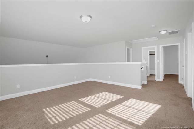 spare room with light colored carpet