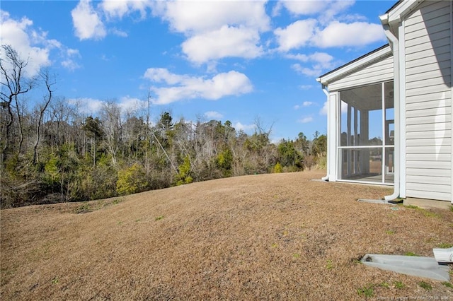 view of yard featuring a sunroom