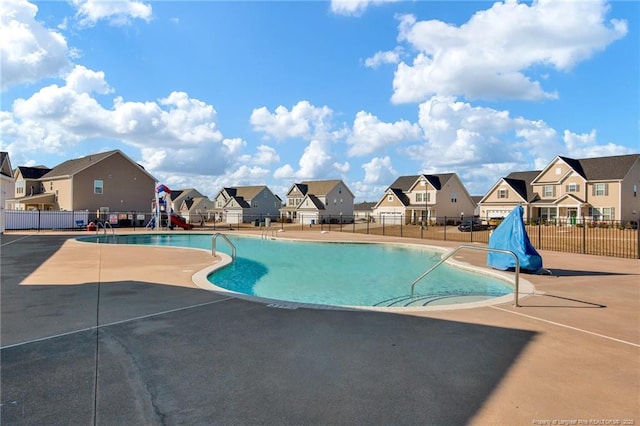 view of swimming pool with a patio area