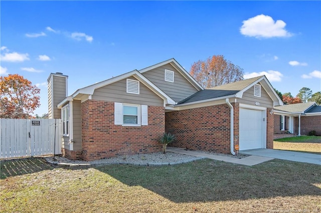 view of front facade with a front yard and a garage