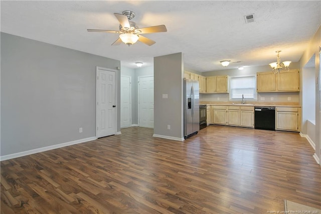 kitchen featuring black appliances, ceiling fan with notable chandelier, sink, and dark wood-type flooring