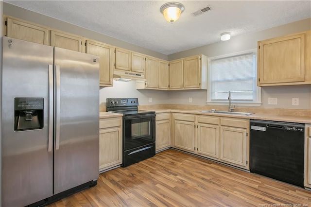 kitchen featuring light wood-type flooring, black appliances, light brown cabinets, and sink