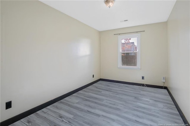 unfurnished room featuring light wood-type flooring