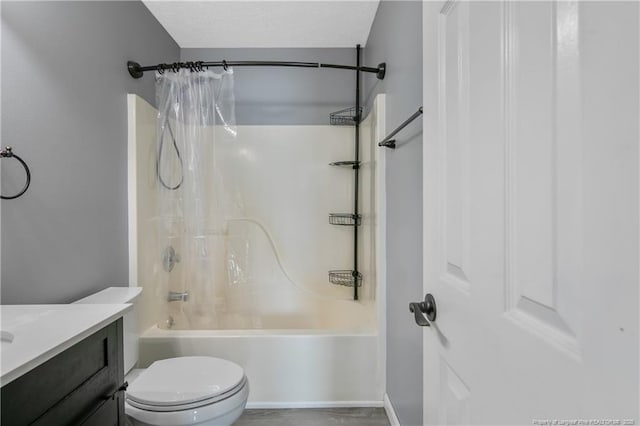 full bathroom featuring shower / bathtub combination with curtain, a textured ceiling, vanity, and toilet