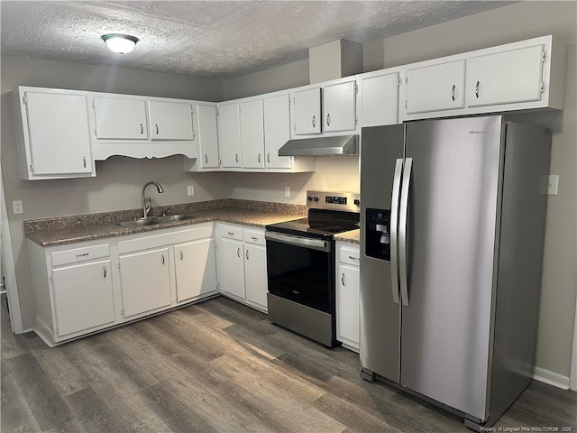 kitchen with a textured ceiling, dark hardwood / wood-style flooring, white cabinetry, appliances with stainless steel finishes, and sink