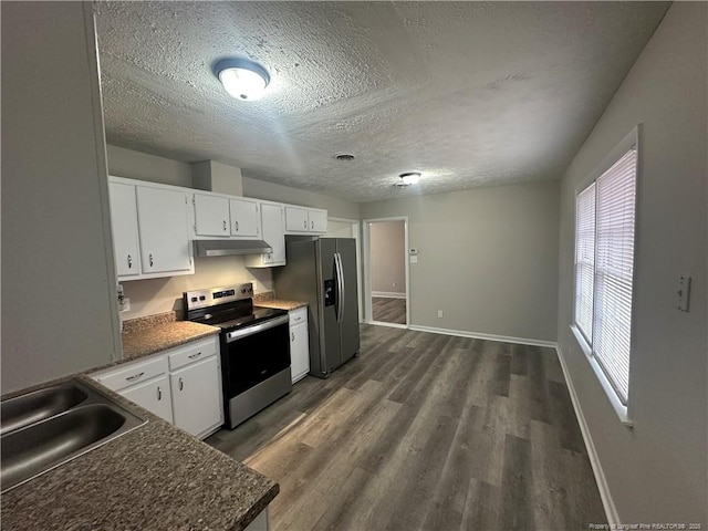 kitchen featuring stainless steel appliances, sink, white cabinets, a textured ceiling, and dark hardwood / wood-style floors