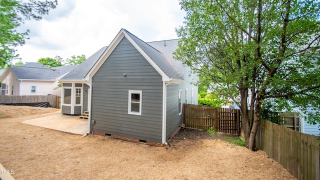 back of property featuring a patio