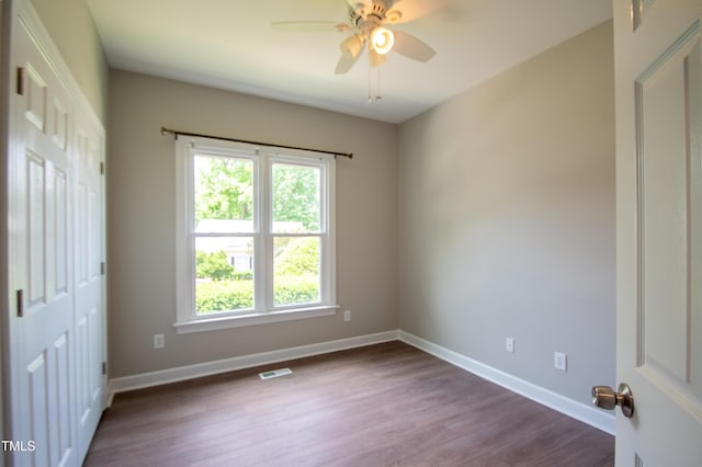 spare room with ceiling fan and hardwood / wood-style floors