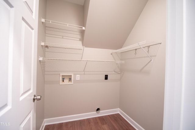 washroom with hardwood / wood-style floors, hookup for a washing machine, and hookup for an electric dryer