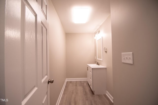 bathroom with vanity and hardwood / wood-style floors