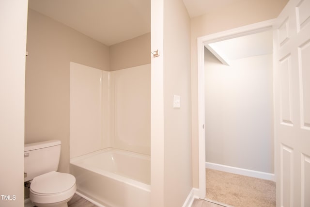 bathroom featuring toilet and shower / washtub combination