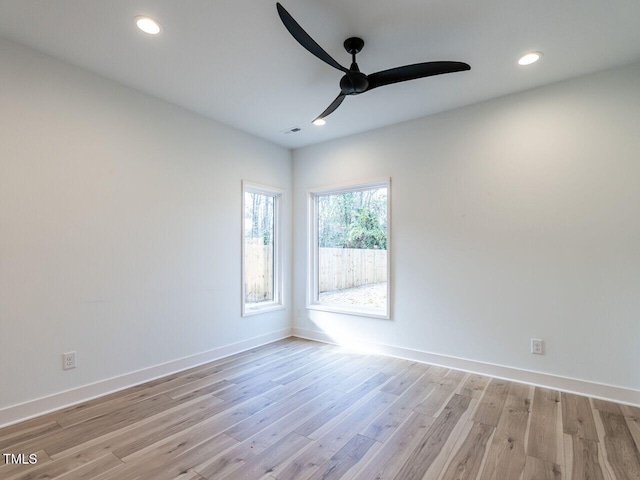 unfurnished room featuring ceiling fan and light hardwood / wood-style floors