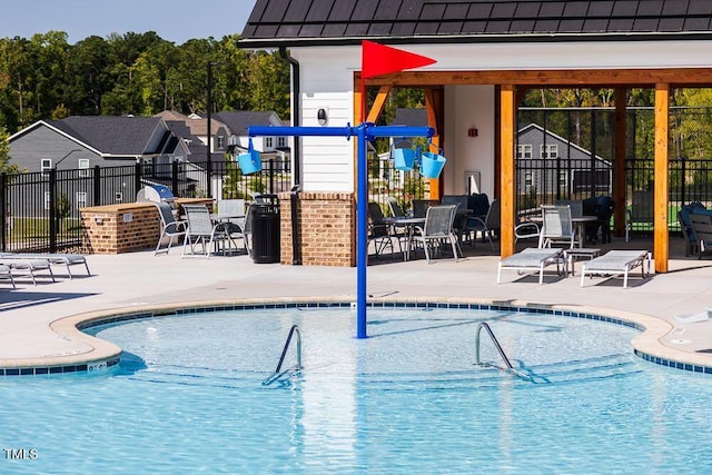 view of swimming pool featuring a patio area