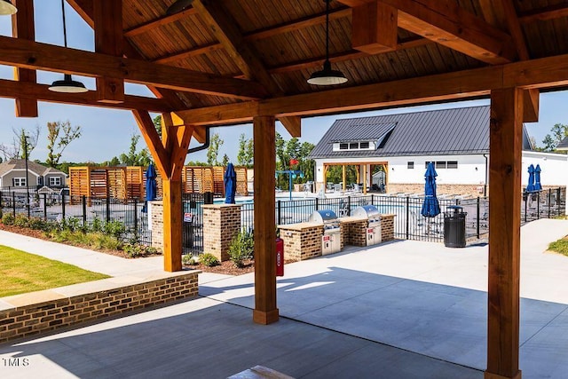 view of patio / terrace featuring a gazebo and exterior kitchen