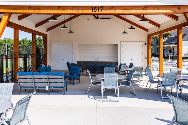 view of patio / terrace with ceiling fan and an outdoor living space