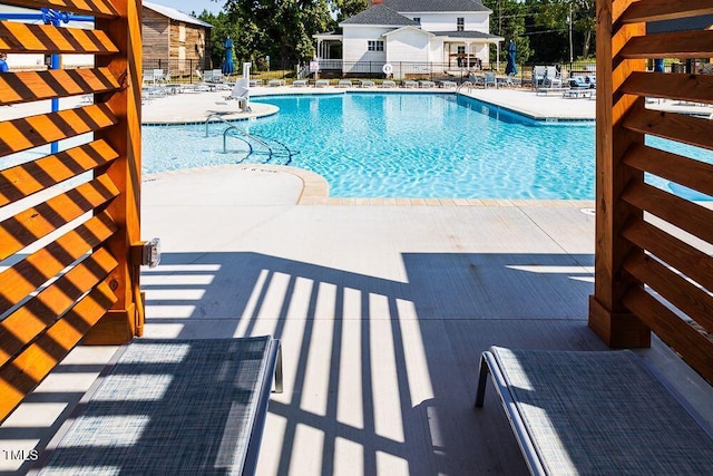 view of swimming pool featuring a patio