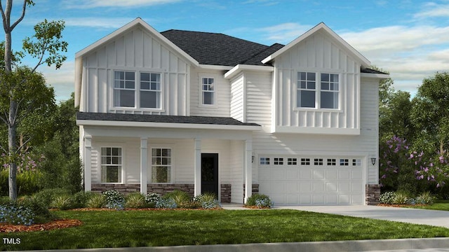 view of front of property featuring a front lawn and a garage