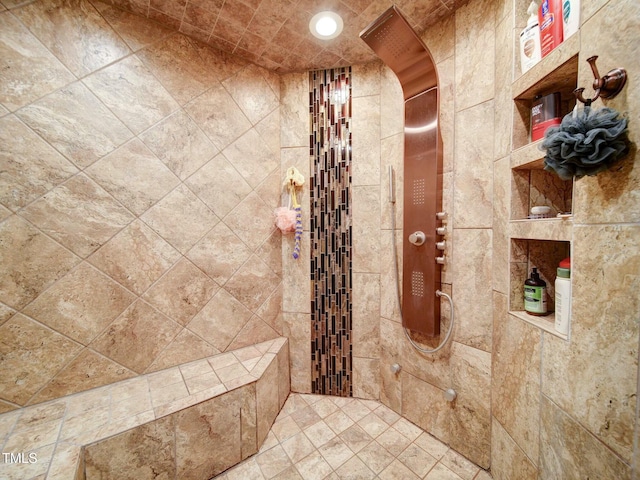 bathroom featuring a tile shower