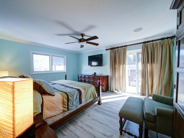 bedroom featuring light wood-type flooring, ceiling fan, and ornamental molding