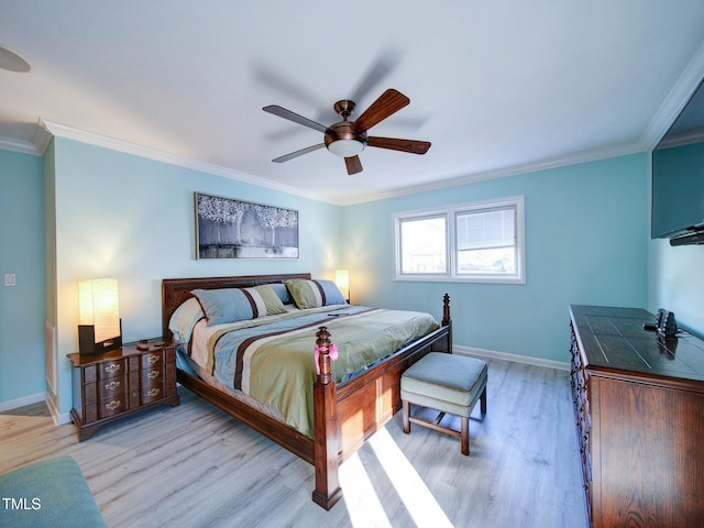 bedroom with ceiling fan, crown molding, and light wood-type flooring