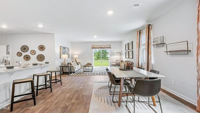 dining space featuring hardwood / wood-style floors