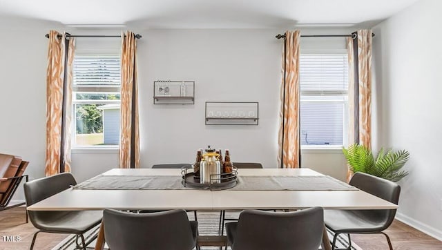 dining space featuring light hardwood / wood-style floors